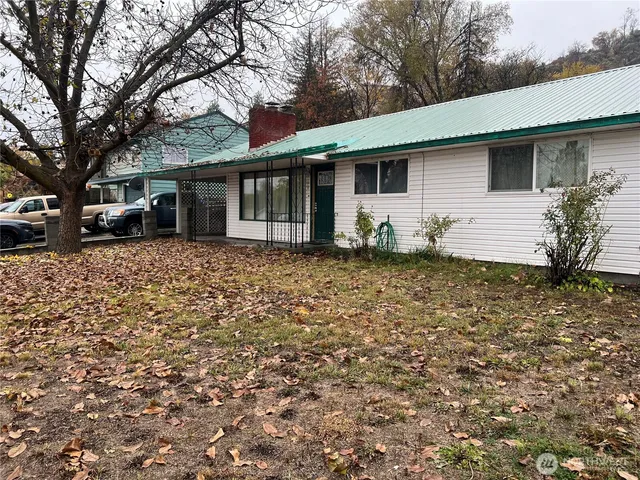 a house with trees in the background