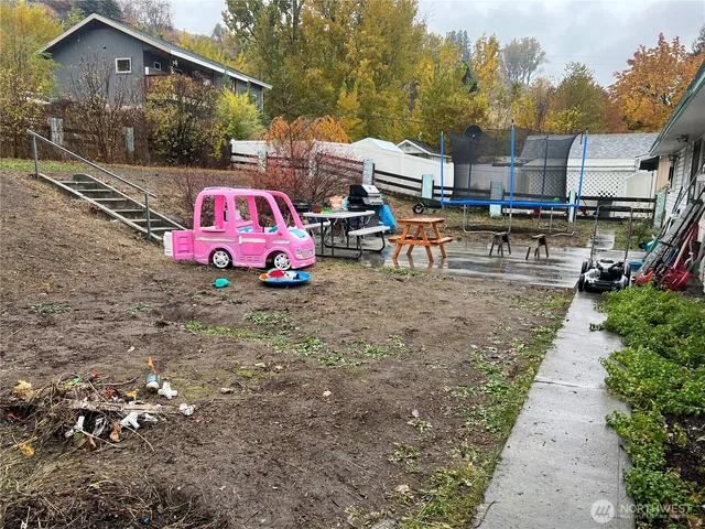 a childrens park with lots of swings and slides