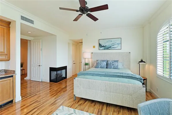 a bedroom with a bed and a couch