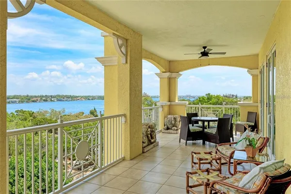 a view of a chairs and table in patio