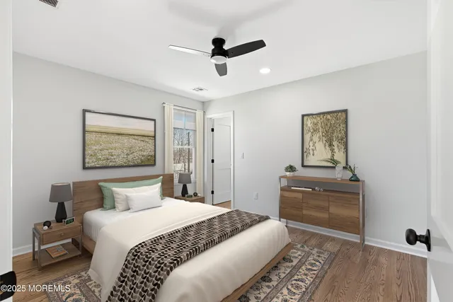 a bathroom with a toilet sink vanity tub and shower