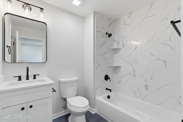 a bedroom with bed and a window