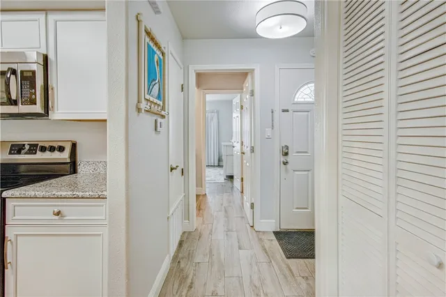 a view of a bathroom with a sink and a mirror