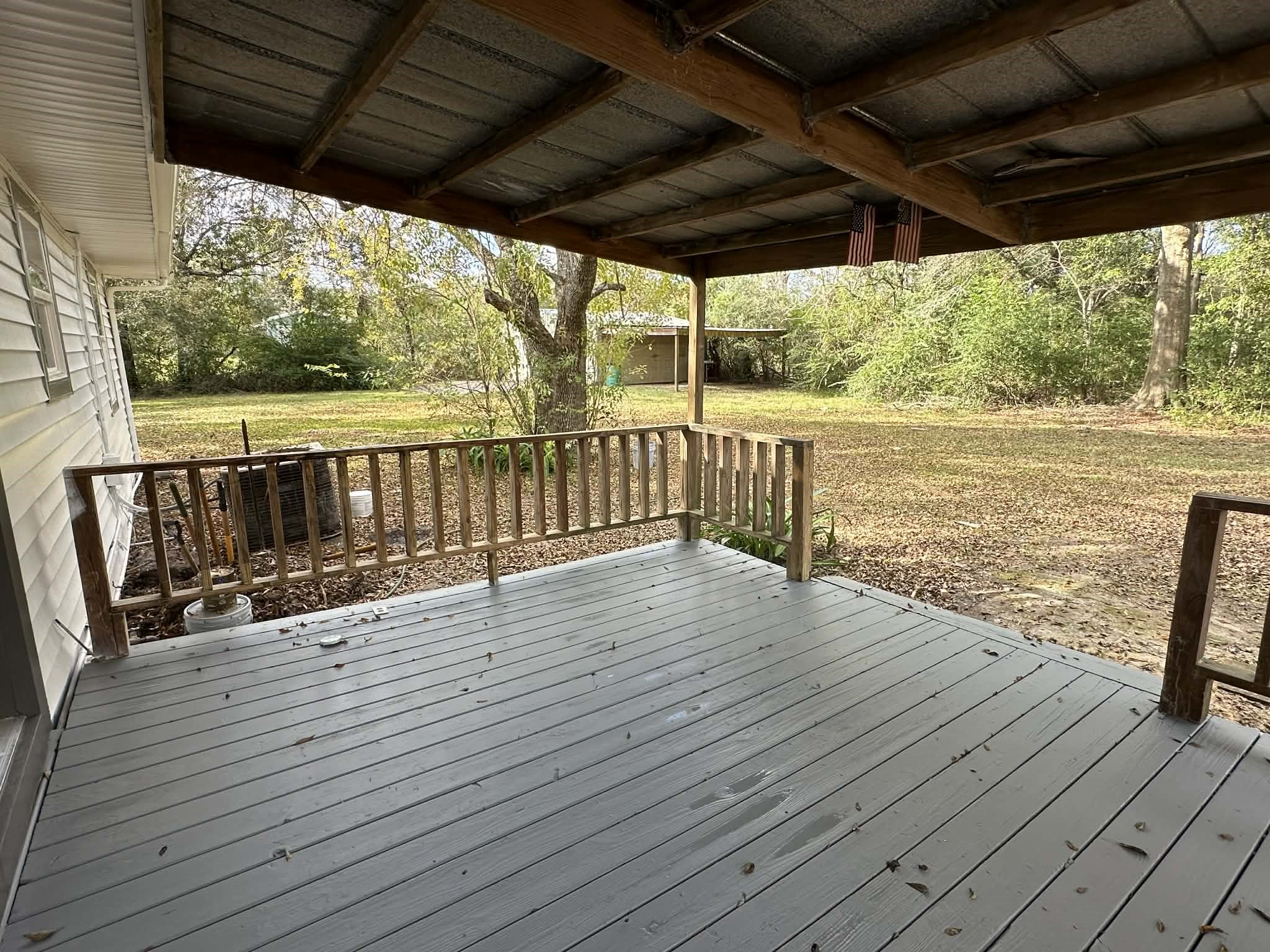 614 Fm 1406 Road Winnie, TX 77665 - Photo 16 of 25 a view of deck with wooden floor and outdoor space