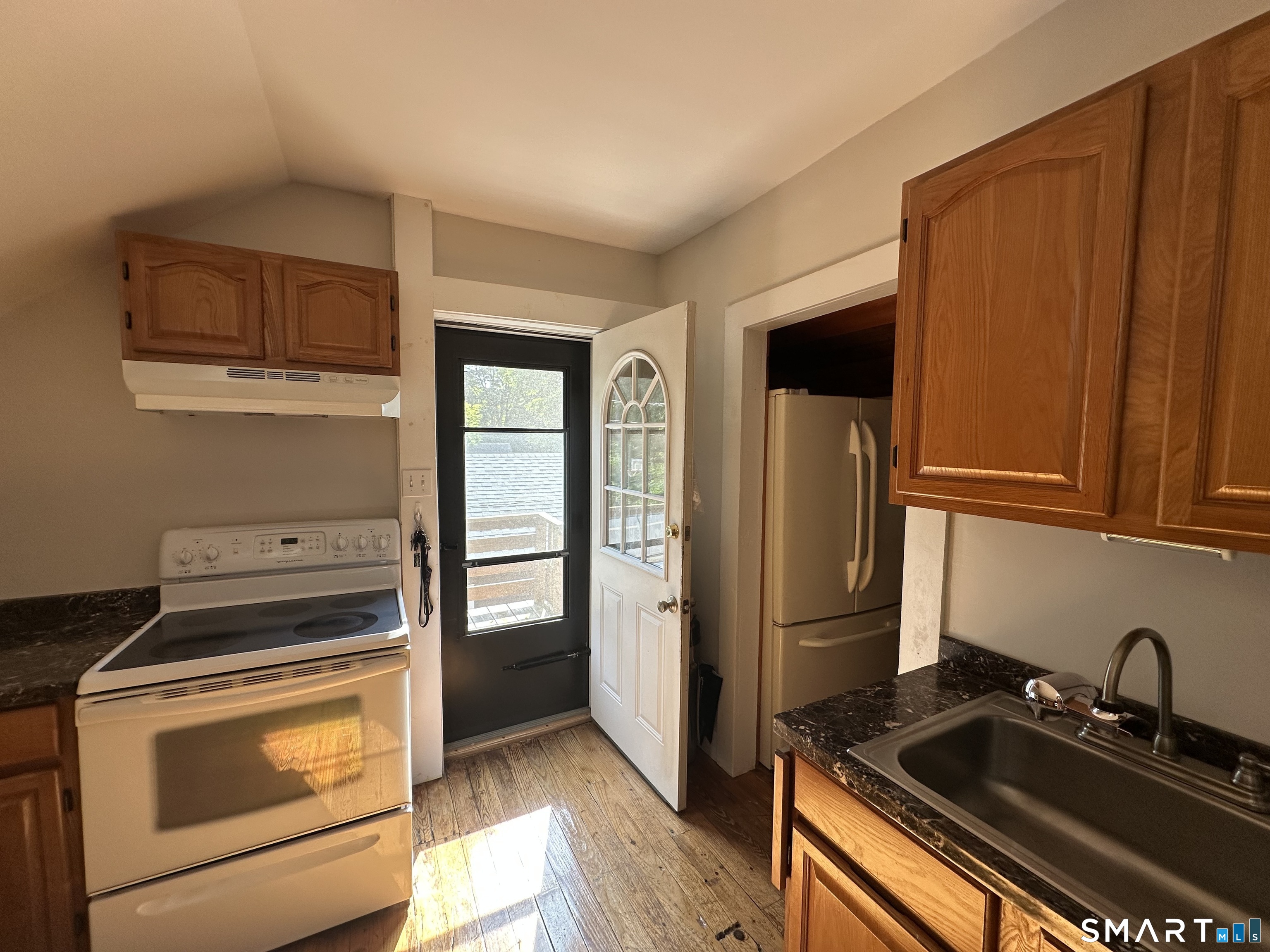 22 North Main Street, Unit 2 East Hampton, CT 06424 - Photo 5 of 17 Kitchen is equipped with an electric stove and refrigerator.