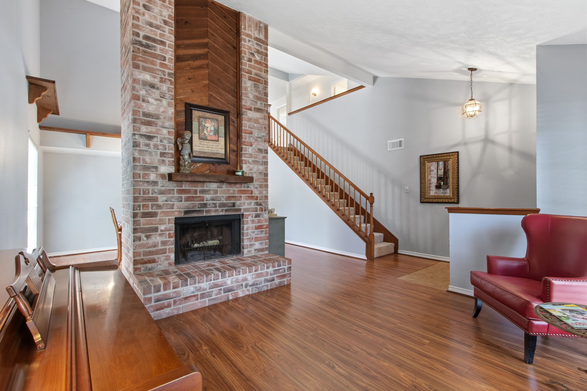 4835 Ingleside Court Spring, TX 77388 - Photo 8 of 50 LIVING & DINING ROOM - These two rooms are separated by a wood-burning fireplace. It is a beautiful focal point for both rooms.