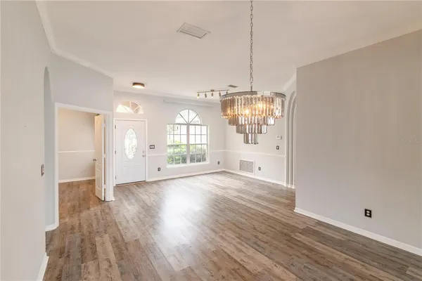 a view of washer and dryer with wooden floor