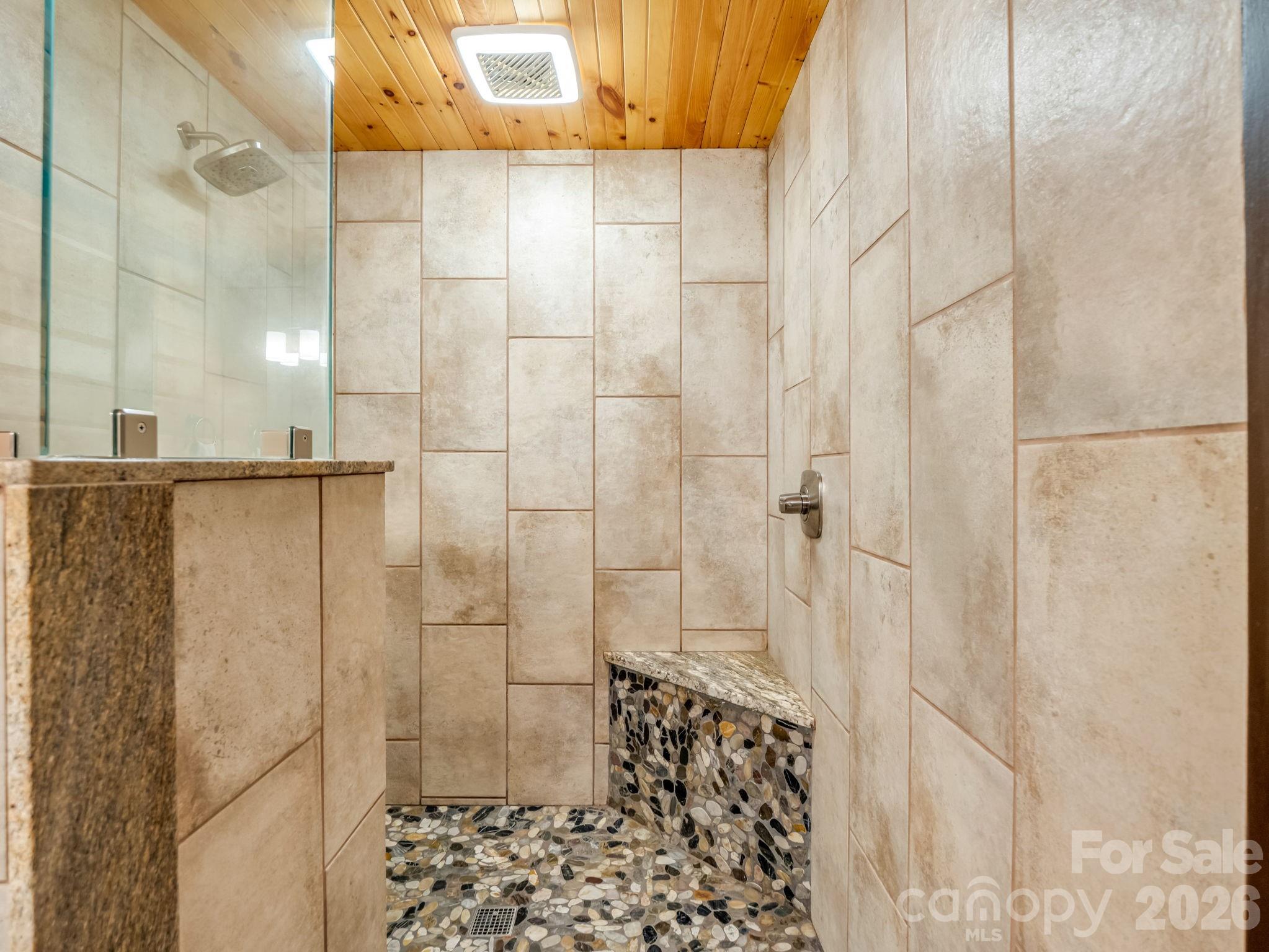 590 Boulder Ridge Lake Lure, NC 28746 - Photo 24 of 48 a bathroom with a shower