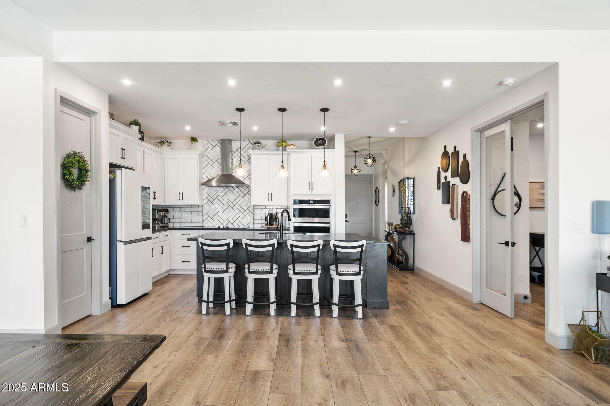 4876 North Yorkshire Loop Prescott Valley, AZ 86314 - Photo 15 of 47 a dining room with stainless steel appliances furniture a refrigerator and kitchen view