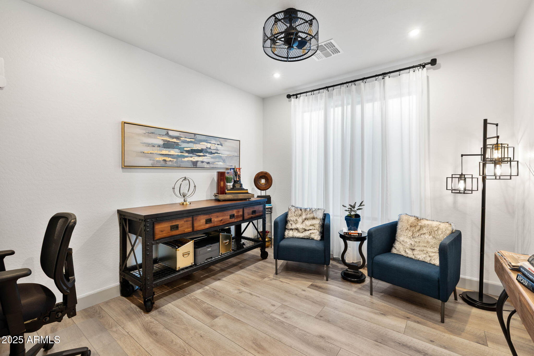 4876 North Yorkshire Loop Prescott Valley, AZ 86314 - Photo 18 of 47 a view of a livingroom with furniture and windows