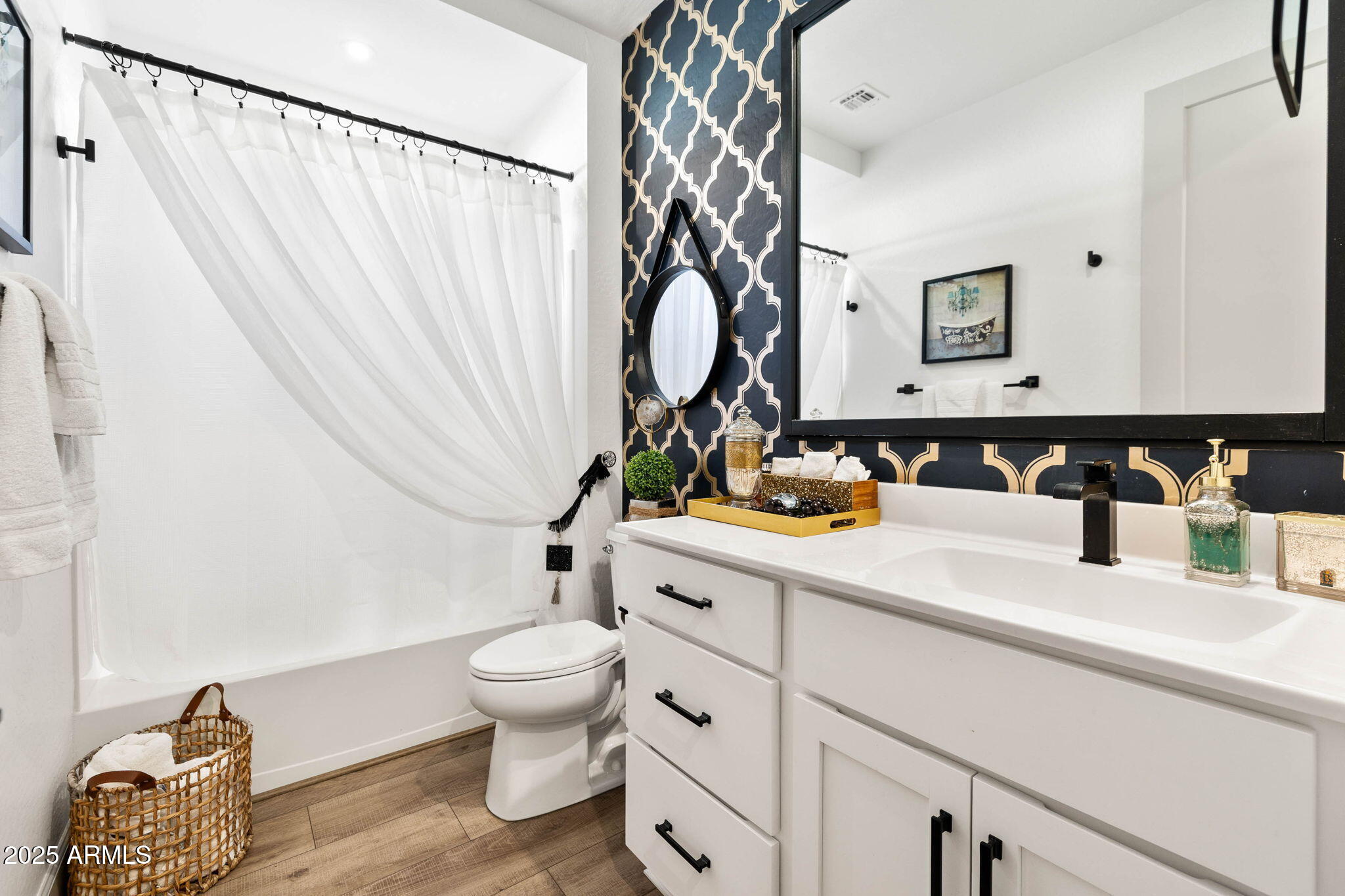 4876 North Yorkshire Loop Prescott Valley, AZ 86314 - Photo 22 of 47 a bathroom with a sink a toilet and a mirror
