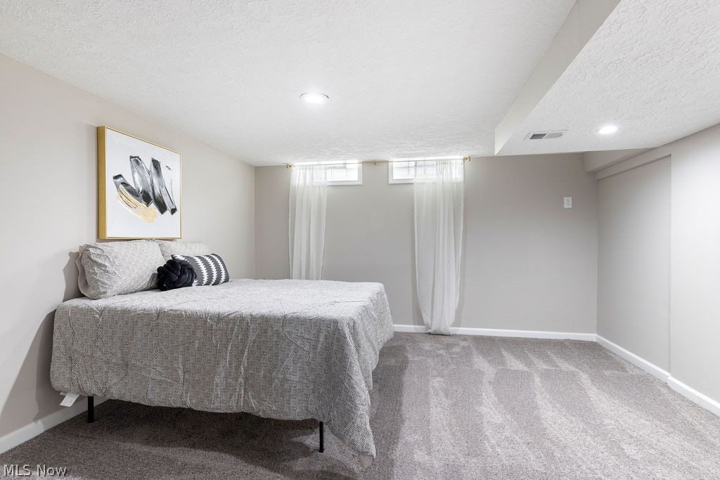 9620 David Road Garfield Heights, OH 44125 - Photo 28 of 36 Bedroom featuring carpet and a textured ceiling