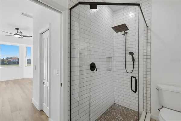a bathroom with double vanity sinks and a mirror