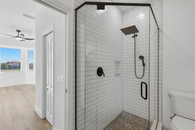 a bathroom with double vanity sinks and a mirror