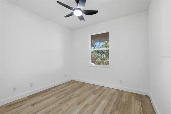a bathroom with a toilet a sink a mirror and bathtub