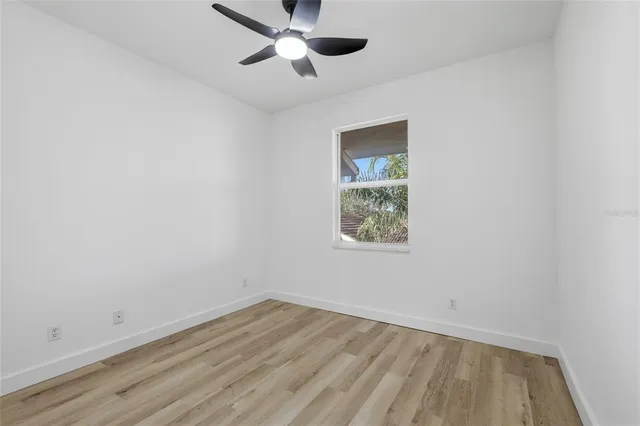 a bathroom with a toilet a sink a mirror and bathtub