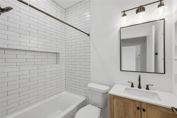 a view of a porch with a table and chairs