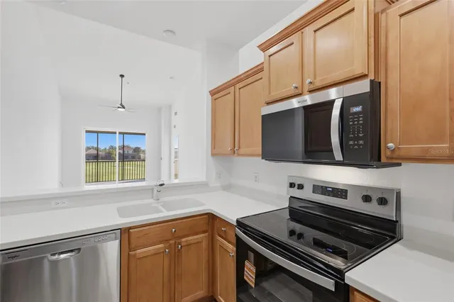 a kitchen with a sink and a window