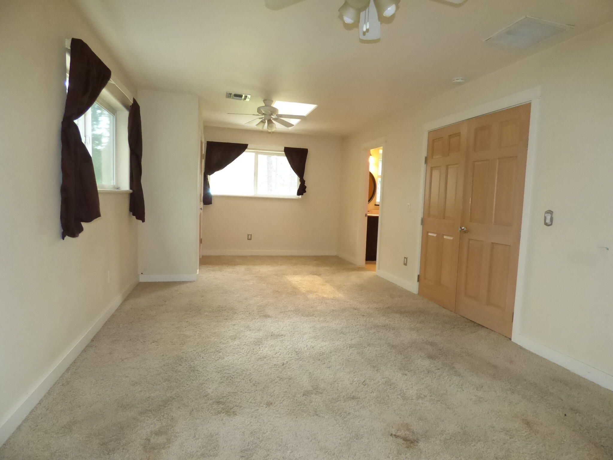 7414 Redthorne Road Rogue River, OR 97537 - Photo 16 of 32 en empty room with fan and entrance