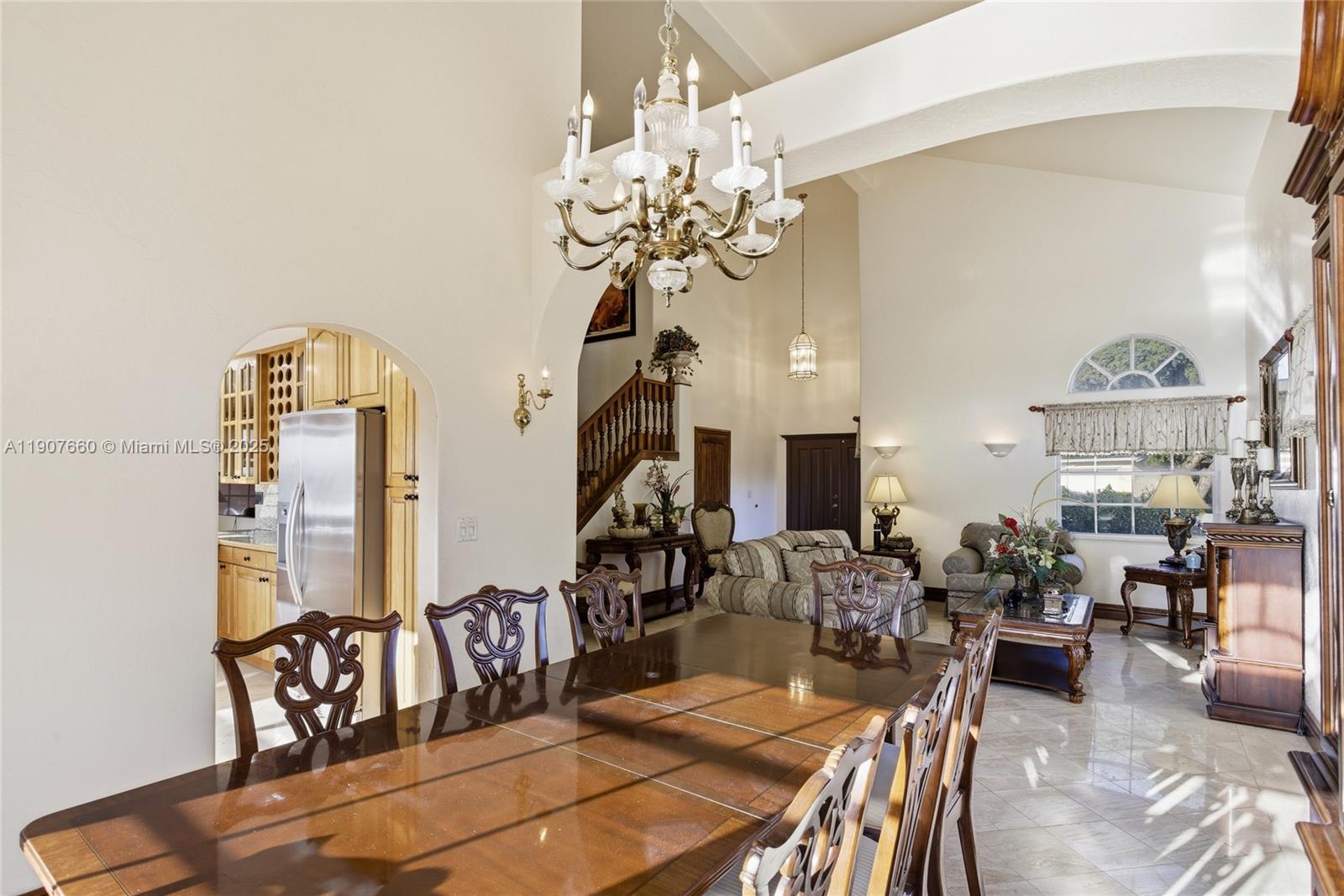 20816 Southwest 85th Place Cutler Bay, FL 33189 - Photo 14 of 49 a view of a dining room with furniture and chandelier