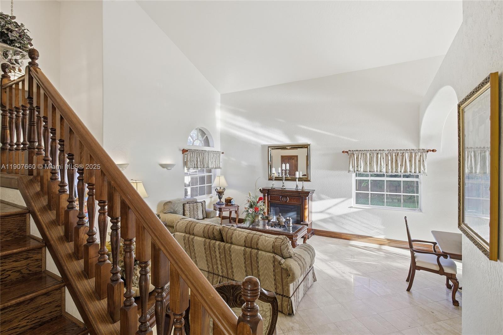 20816 Southwest 85th Place Cutler Bay, FL 33189 - Photo 17 of 49 a living room with furniture floor to ceiling window and a rug
