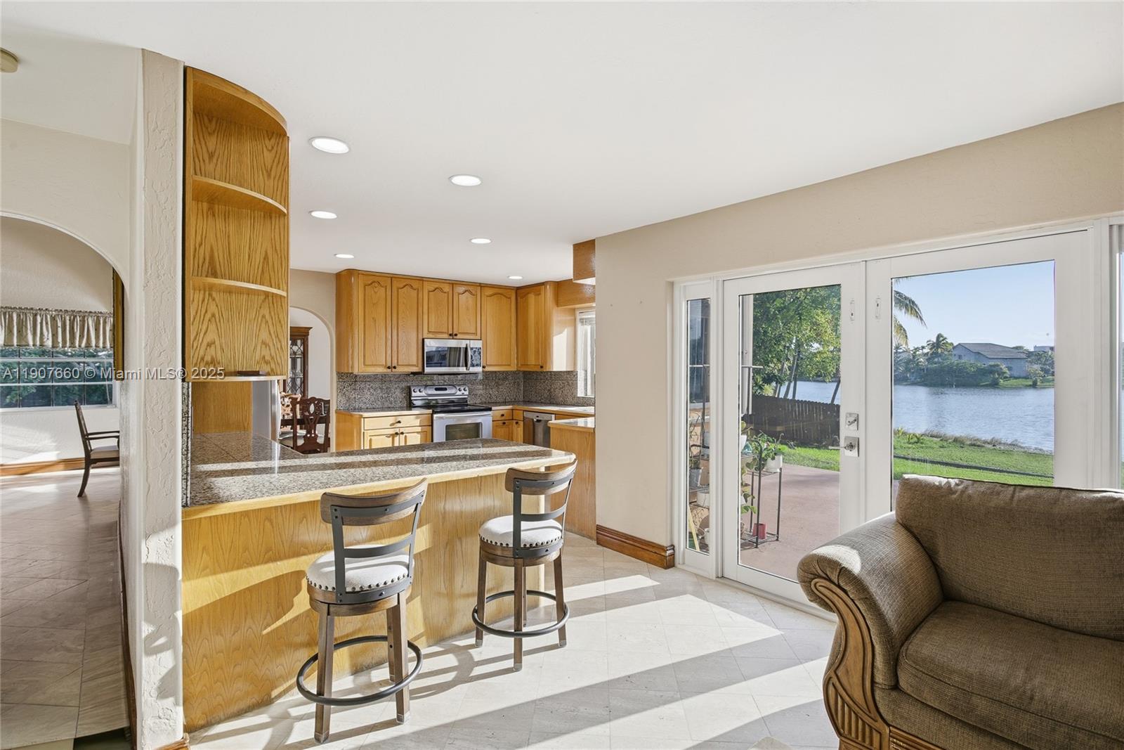 20816 Southwest 85th Place Cutler Bay, FL 33189 - Photo 21 of 49 a living room with furniture and a kitchen view