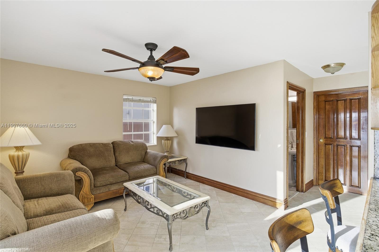 20816 Southwest 85th Place Cutler Bay, FL 33189 - Photo 22 of 49 a living room with furniture and a flat screen tv