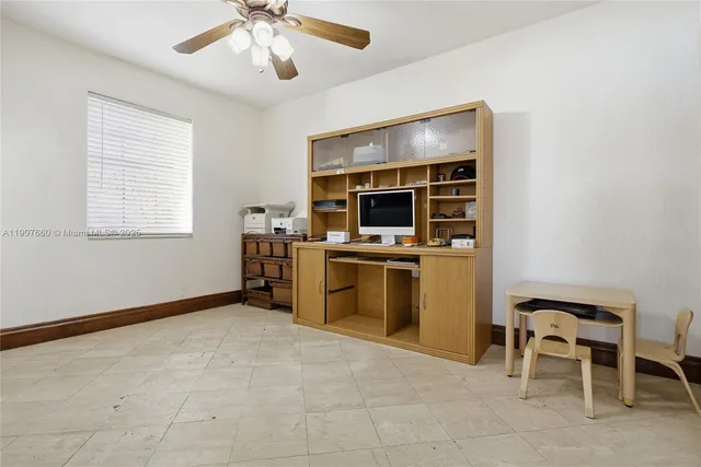 a kitchen with a stove cabinets and microwave