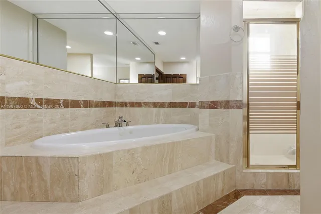 a bathroom with a bathtub and a sink