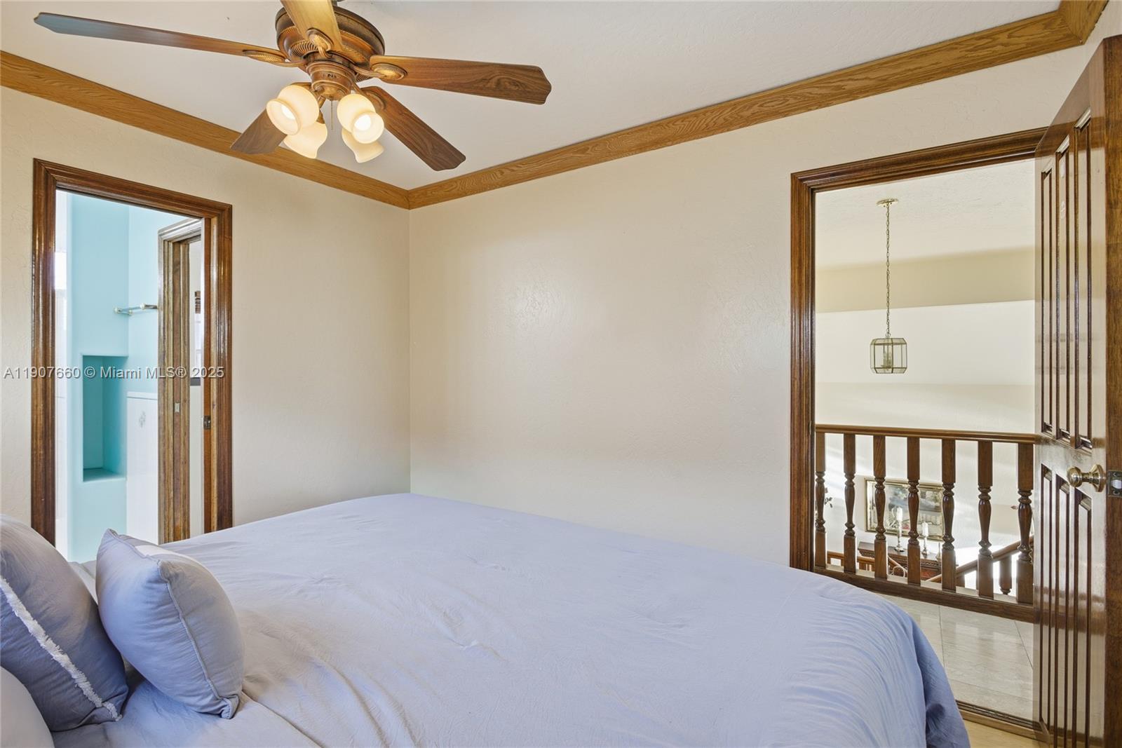 20816 Southwest 85th Place Cutler Bay, FL 33189 - Photo 37 of 49 a bedroom with a bed and a window