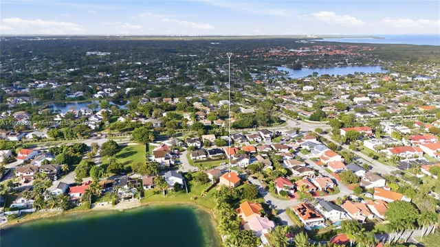 an aerial view of residential building with green space