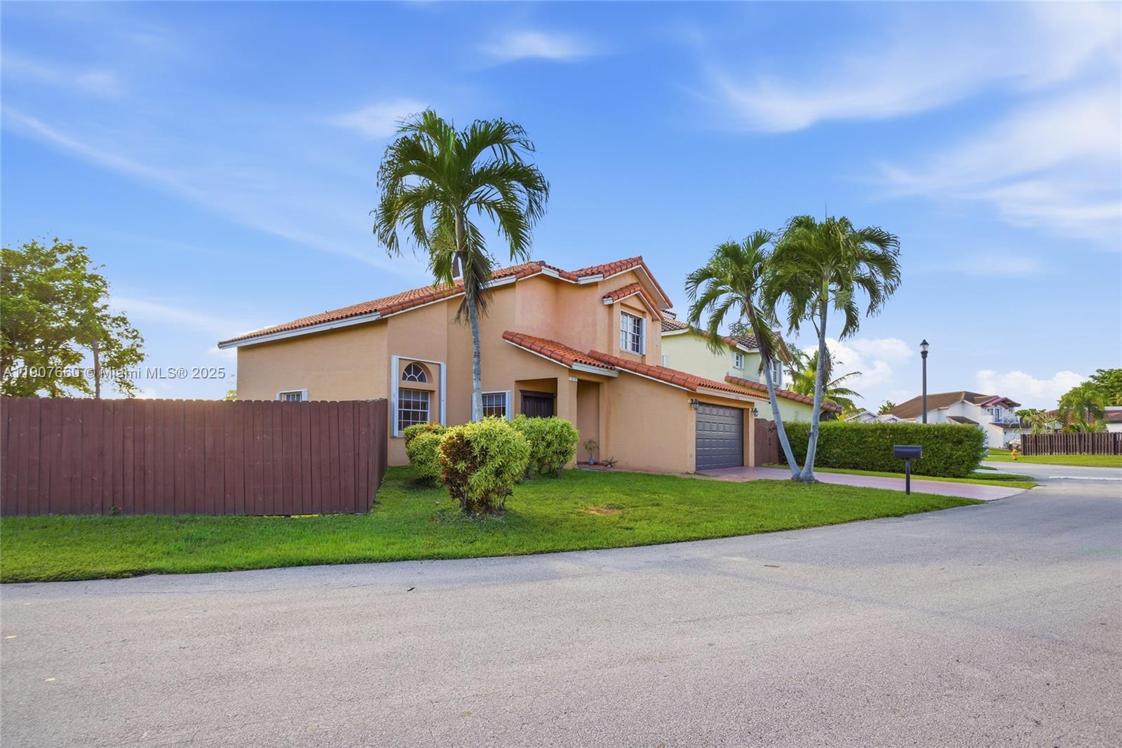 20816 Southwest 85th Place Cutler Bay, FL 33189 - Photo 6 of 49 a front view of house with yard and green space