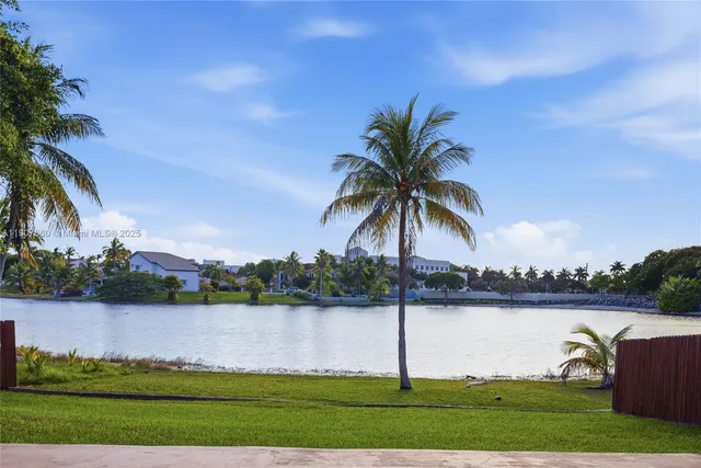 a swimming pool with outdoor seating and yard