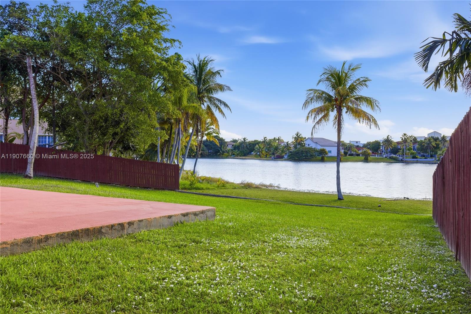 20816 Southwest 85th Place Cutler Bay, FL 33189 - Photo 9 of 49 a view of a yard and palm trees