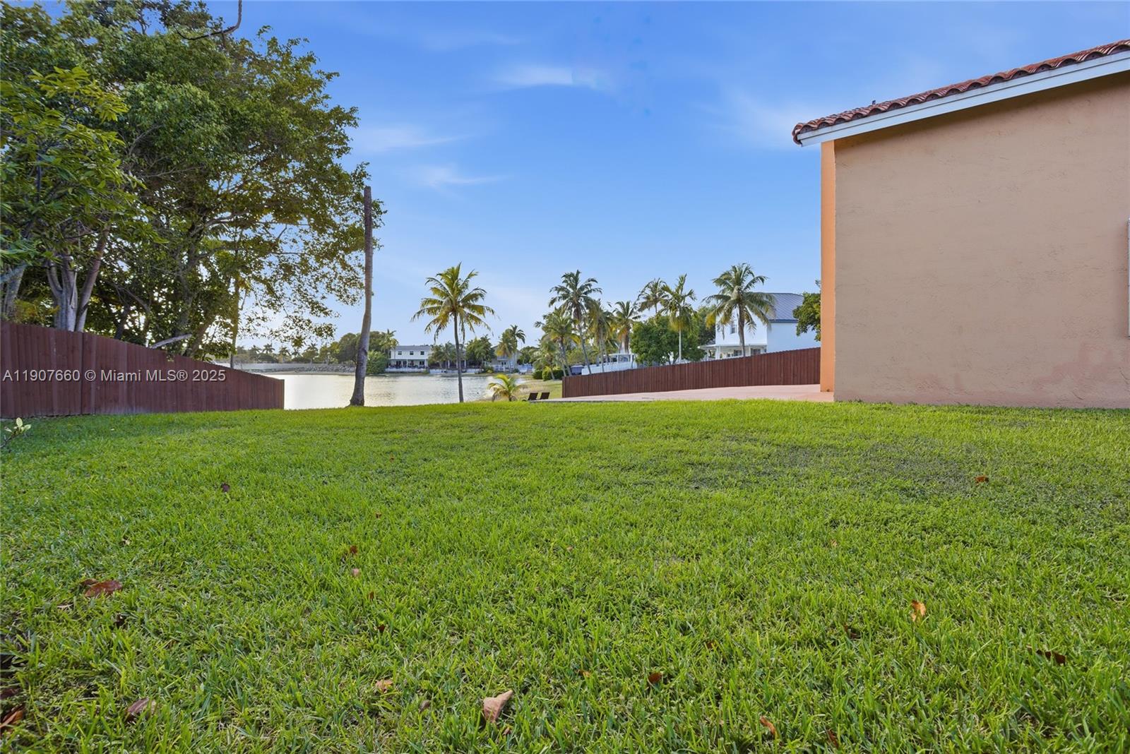 20816 Southwest 85th Place Cutler Bay, FL 33189 - Photo 10 of 49 a view of yard with grass and a palm tree