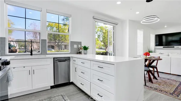 a kitchen with cabinets a window and a sink