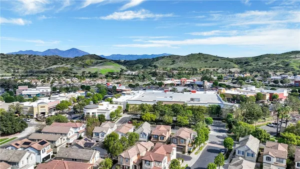 a view of a patio with table and chairs and potted plants
