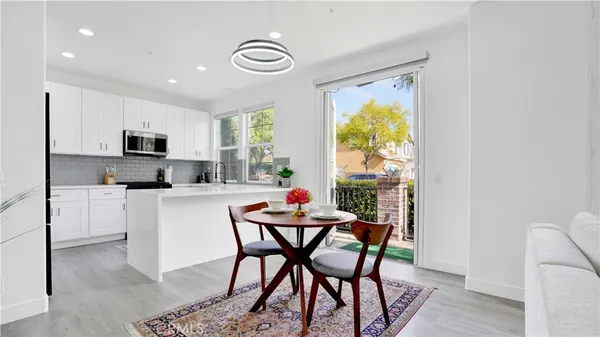 a dining room with furniture and window