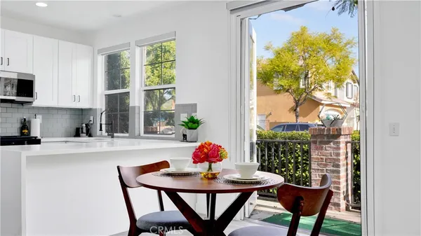 a view of a dining room with furniture window and outside view