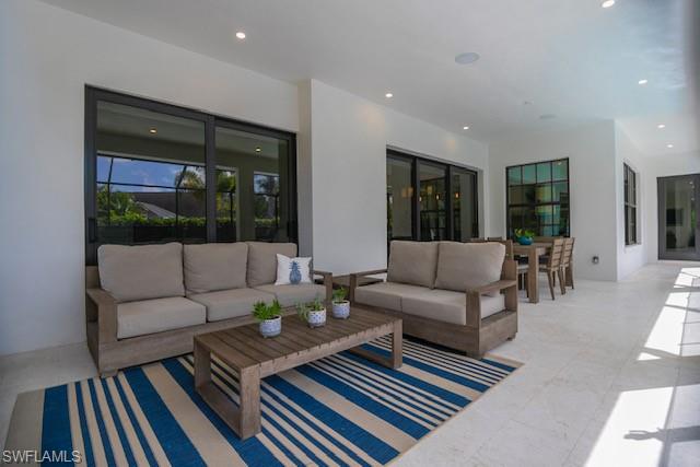 Undisclosed Address Naples, FL 34110 - Photo 4 of 18 a living room with furniture and a rug