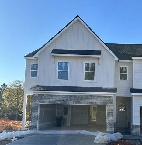 a front view of a house with yard