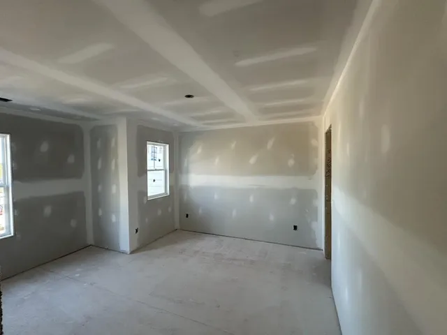an empty room with windows