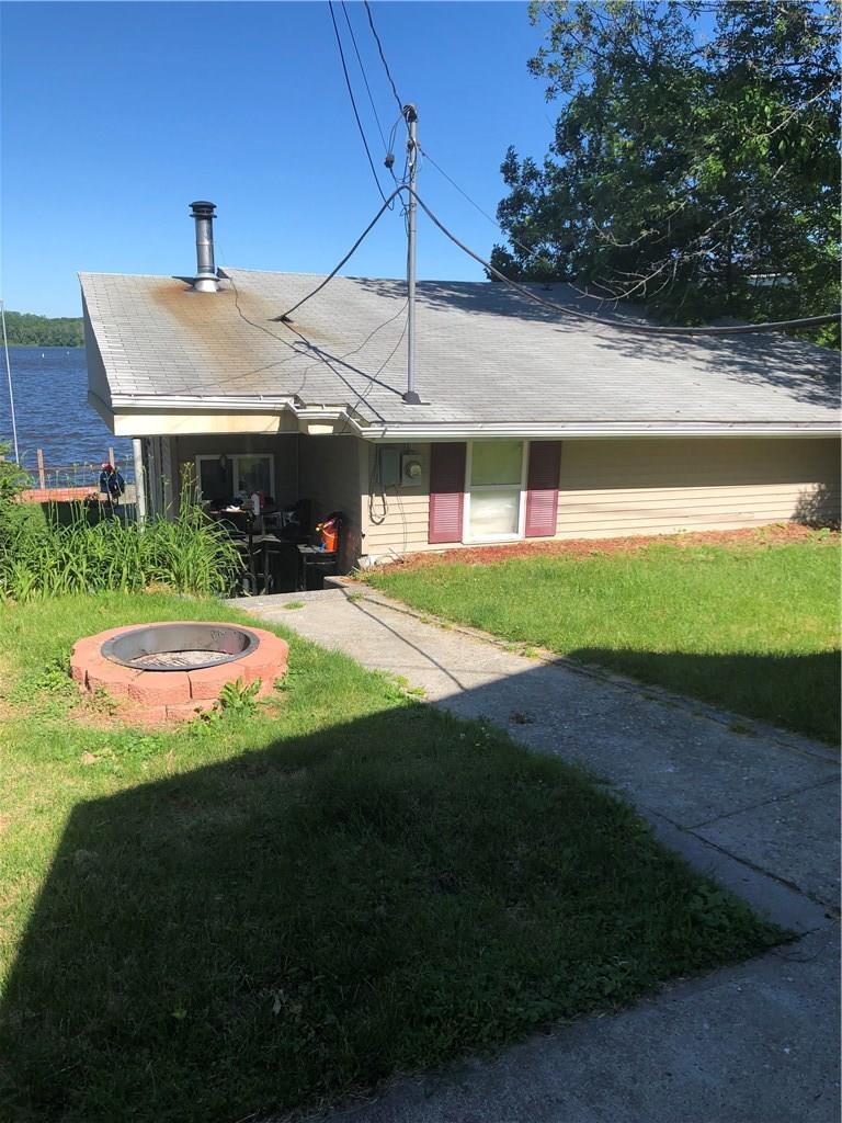 218 Sunset Cove Road Newburgh, NY 12550 - Photo 1 of 1 a front view of a house with a yard table and chairs