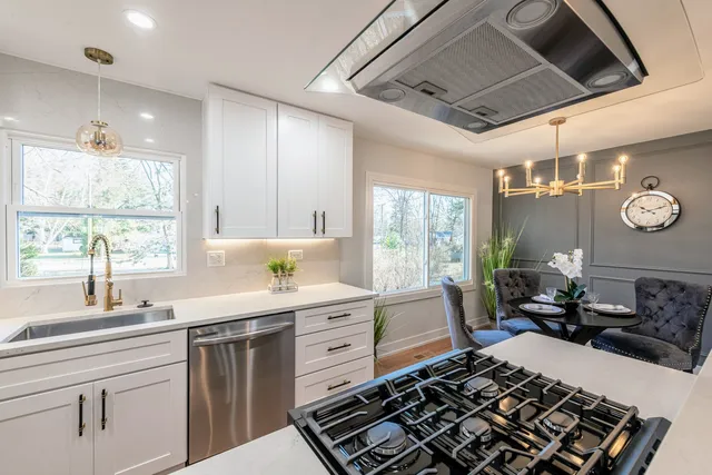 a kitchen with a table and chairs in it