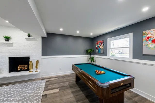 a living room with furniture flat screen tv and potted plant