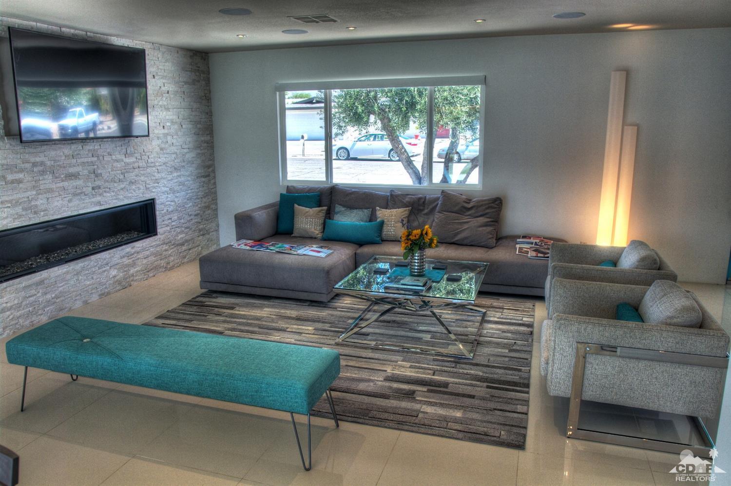 465 East Simms Road Palm Springs, CA 92262 - Photo 2 of 41 a living room with furniture and a fireplace