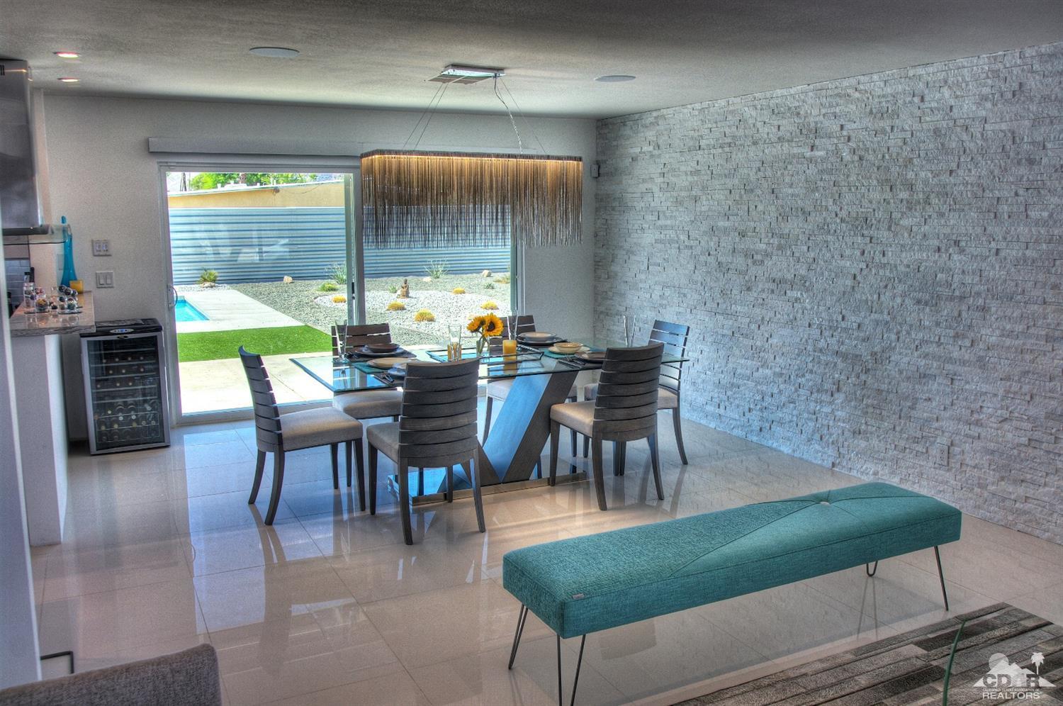 465 East Simms Road Palm Springs, CA 92262 - Photo 11 of 41 a view of a dining room with furniture and a large window