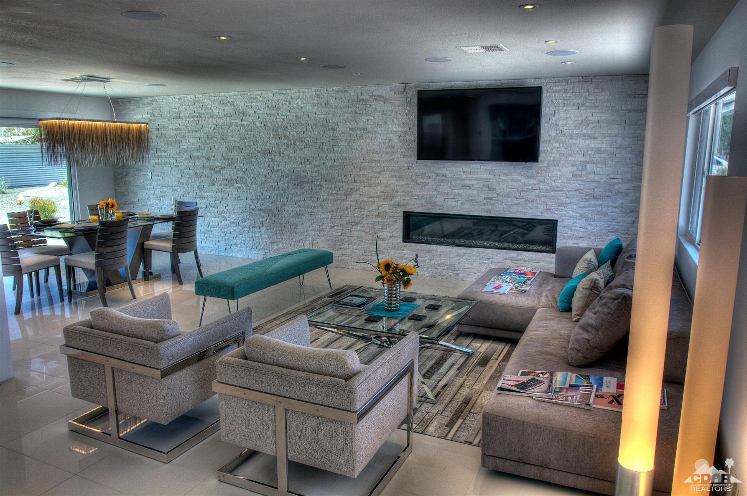 465 East Simms Road Palm Springs, CA 92262 - Photo 12 of 41 a living room with furniture and a fireplace