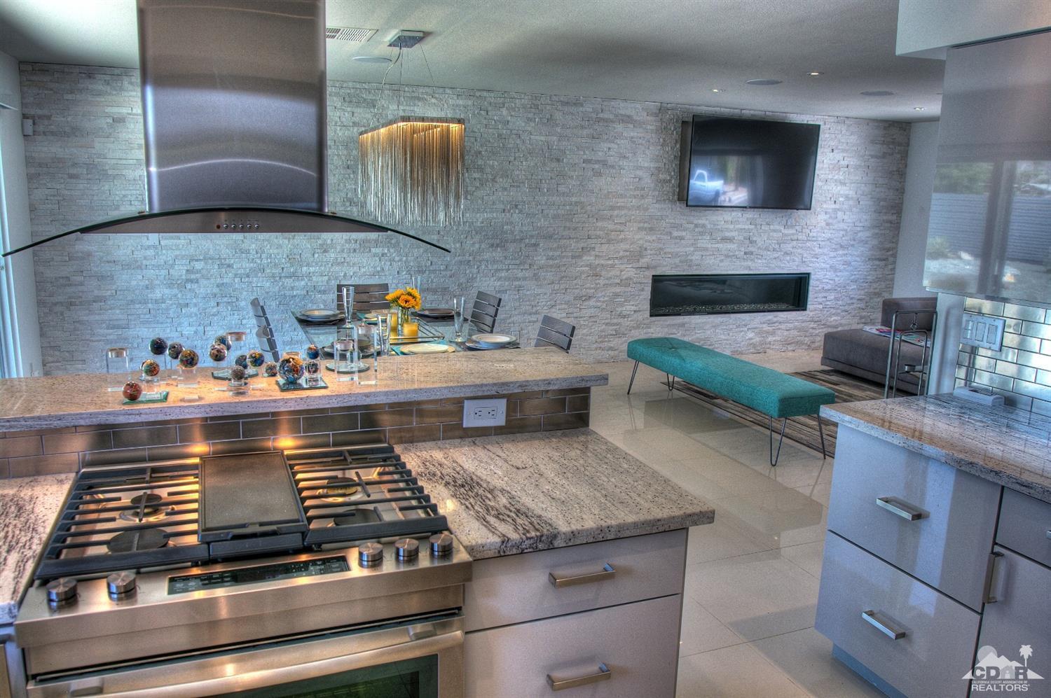 465 East Simms Road Palm Springs, CA 92262 - Photo 18 of 41 a stove top oven sitting inside of a kitchen