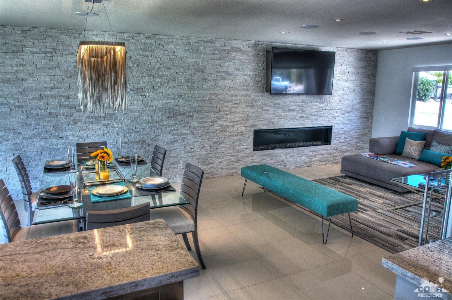 465 East Simms Road Palm Springs, CA 92262 - Photo 3 of 41 a living room with furniture and a fireplace